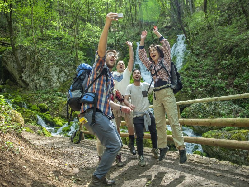group-friends-having-fun-taking-selfies-nature